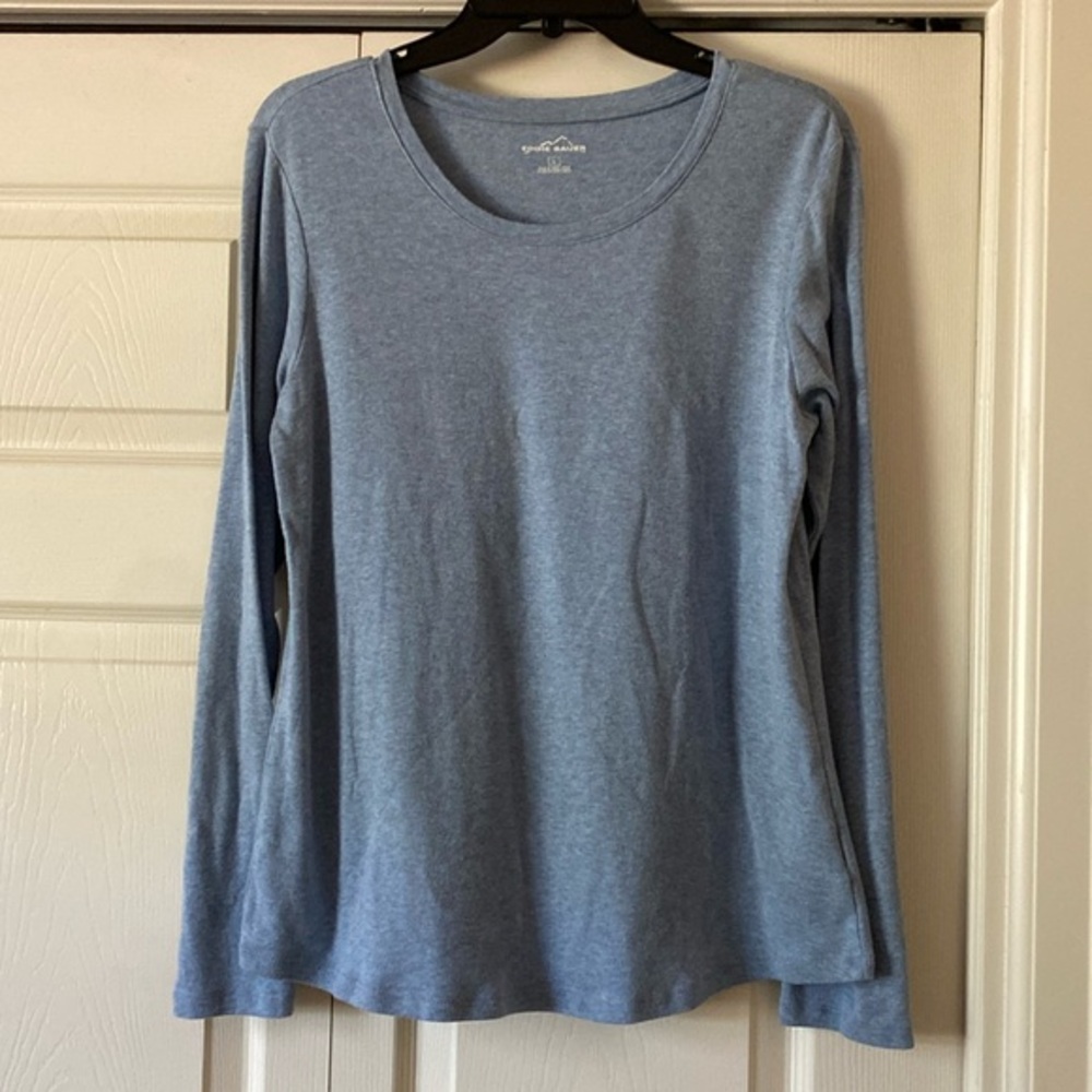 Eddie Bauer shirt. Long sleeve. Curved at bottom.
